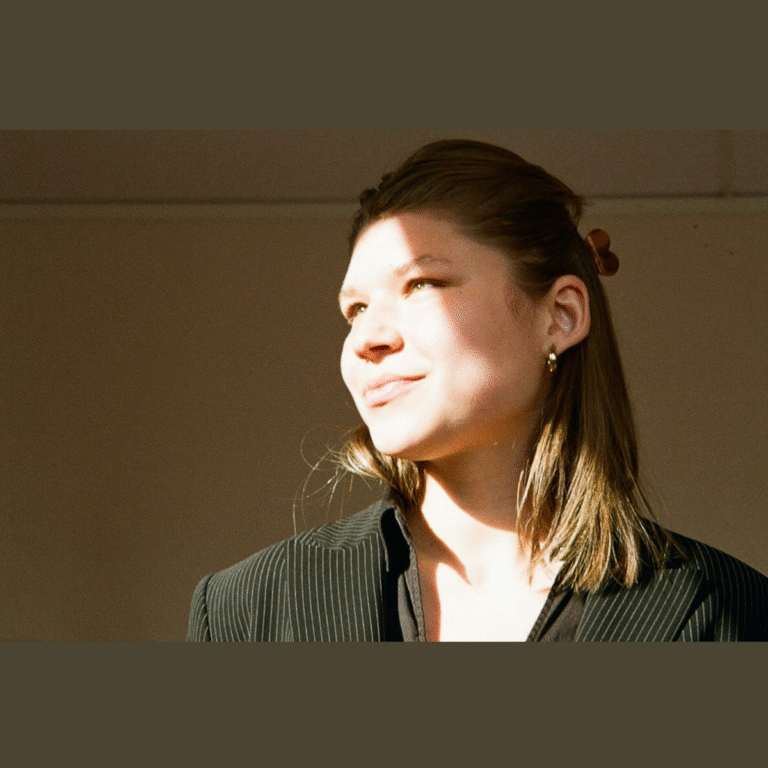 Feni Lab reflection on agreeableness — woman bathed in sunlight, representing kindness, empathy, and personal growth for women embracing their true selves.